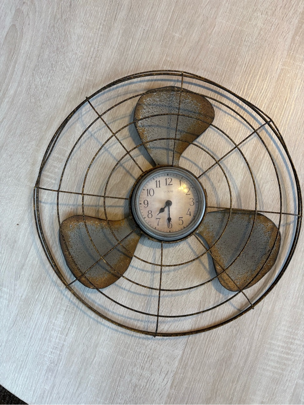 Vintage-Style Metal Fan Wall Clock in Distressed Brown